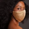 MASCHERA VISO IN PELLE VEGANA CON MOTIVO DENARO ORO